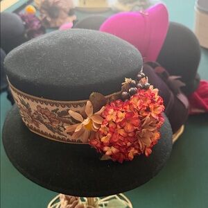 Studio Kokin Chic Black Hat with Vibrant Floral tapestry Design